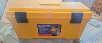 Overall view of yellow Mastercraft toolbox showing latches, handle and label