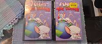 Front view of two Pinky and the Brain Volume 1 DVDs, one sealed, one with price sticker