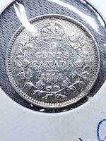 Reverse showing crown, 5 CENTS CANADA 1914 within laurel wreath