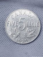 Reverse with CANADA, FIVE CENTS, maple leaves, date 1929