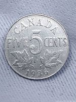 Reverse showing CANADA, FIVE 5 CENTS, maple leaves, date 1936