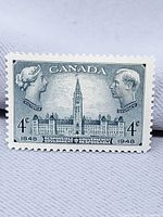 Front view of the 1948 4¢ Canada stamp showing Parliament Buildings, Queen Victoria and King George VI