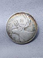 Reverse side showing caribou, denomination and date 1949