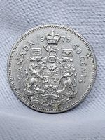 Reverse showing Canadian coat of arms and date 1975