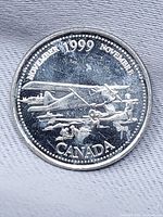 Reverse side of 1999 November Millennium quarter showing airplane design