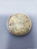 Obverse of 1986 Mexican Libertad 1 Onza silver coin showing winged Victory and inscriptions