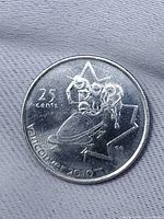 Reverse of 2008 Canadian 25-cent coin featuring bobsleigh design