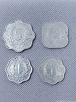 Front view of four East Caribbean States coins: 5¢, 2¢, 1¢, 1¢