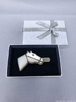 Full view of horse head clip in presentation box