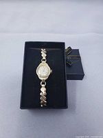 Gold-filled Bulova ladies wristwatch in presentation box showing dial and bracelet