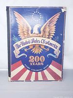 Front cover showing title, eagle graphic, edge wear and small tears