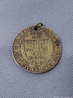 Obverse with crowned shield and advertising legend