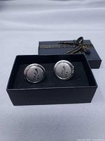 Full view of both cufflinks in box