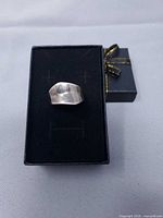 Front view of sterling silver ring in box