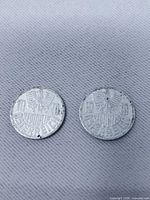 Obverse of both Austrian 10 Groschen coins showing eagle and legend
