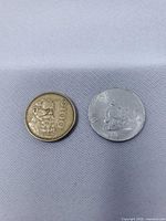 Both Mexican coins side-by-side for size, color and denomination comparison