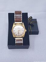 Full view of Timex watch on display, showing dial, case and band