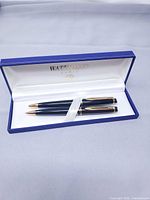 Pen and pencil in open Waterman box