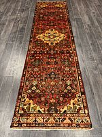 Full length view of Persian runner rug on wood floor