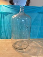 Full view of clear glass carboy