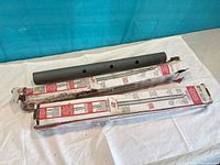 Two boxed adjustable support columns with loose steel tubes