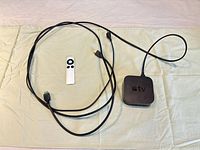 Apple TV unit, remote and HDMI cable overview