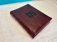 Closed dark brown binder album