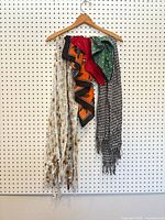 All five scarves hanging on hanger