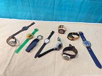 All ten watches laid out showing variety