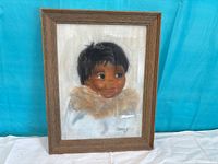 Front view of framed boy portrait artwork
