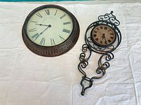 Front view of both wall clocks