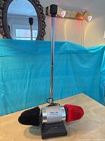 Front view showing polisher, pole, pads, and base