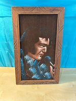 Front view of framed Elvis Presley velvet painting