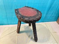 overall view three-legged stool top and legs