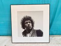 Front view showing Jimi Hendrix portrait, white border and black edge
