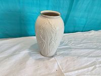 Front view of Lenox ivory porcelain vase showing embossed floral motif