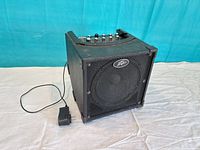 Front and side view of Peavey amplifier with included power adapter