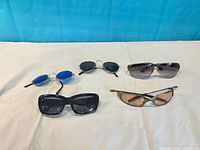All five sunglasses laid out for overview