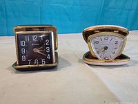 Front view of both open clocks