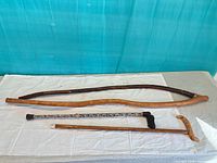 Four canes laid out showing full length and handles