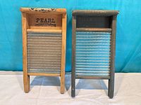 Front view of both washboards showing branding, glass ribs and frame finishes