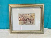 Front view of framed winter scene print showing image, mat, and frame style