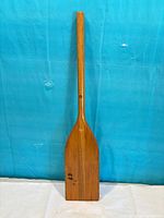 Full view front of wooden paddle