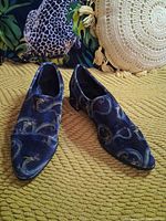 Three-quarter view of both shoes showing pattern and shape