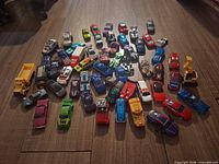 Top view of entire assortment of diecast vehicles spread on floor