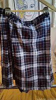 Front view showing plaid pattern and pleats