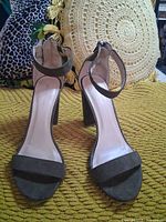 front view of pair showing uppers, ankle straps, heel style