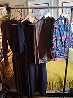 Four garments on rack showing overall lot