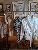 rack showing four outerwear items