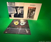 All three album covers displayed against green background